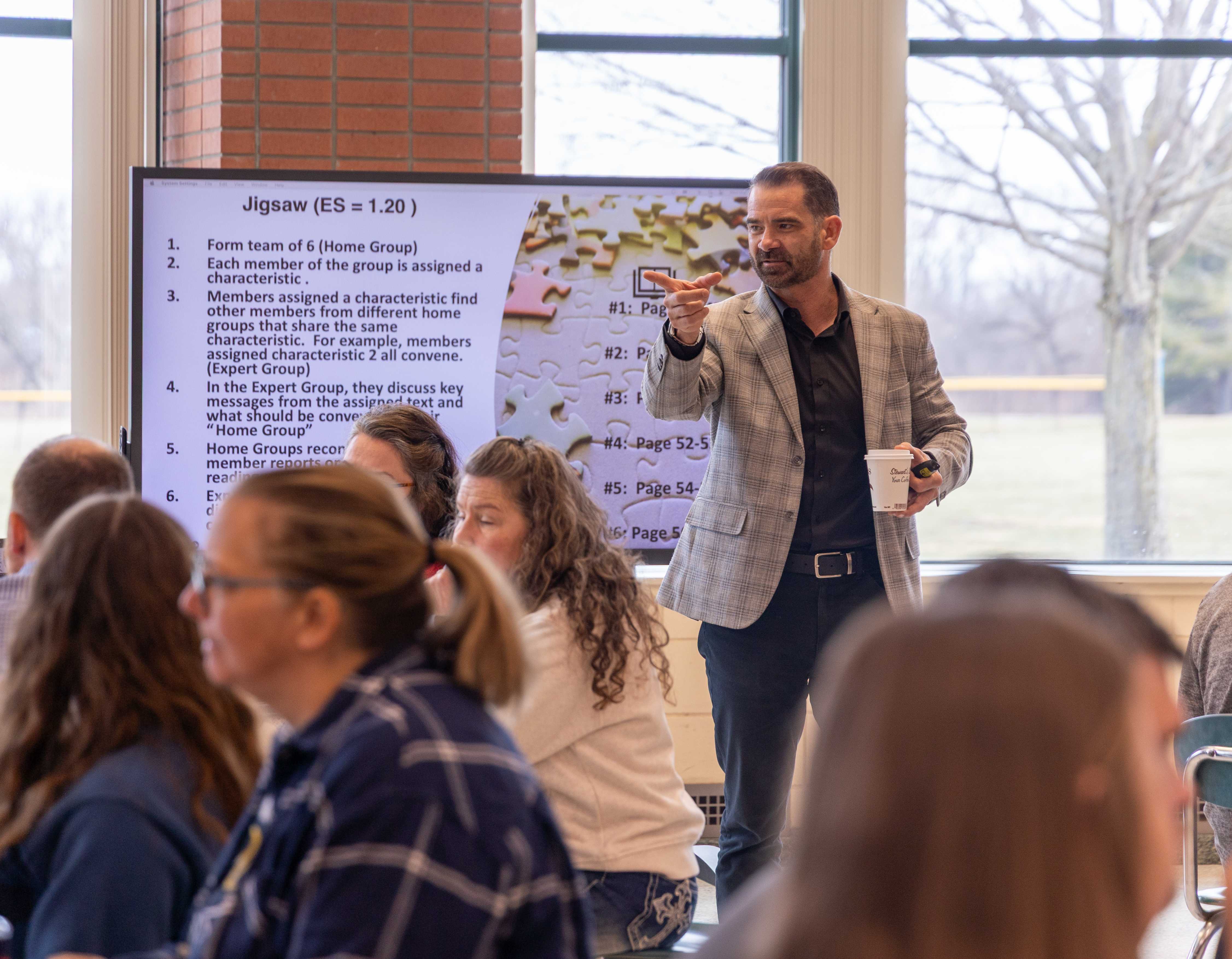 Guest speaker at the HS calls on someone in the crowd